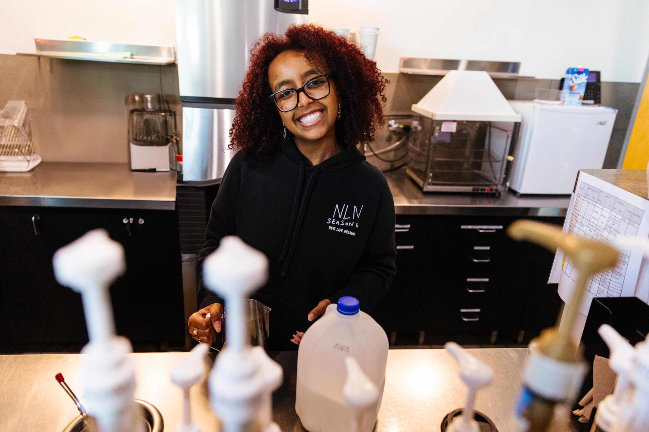 Middle school students at New Life Academy work together on a prototype designed to collect plastic from the ocean during a hands-on science lesson